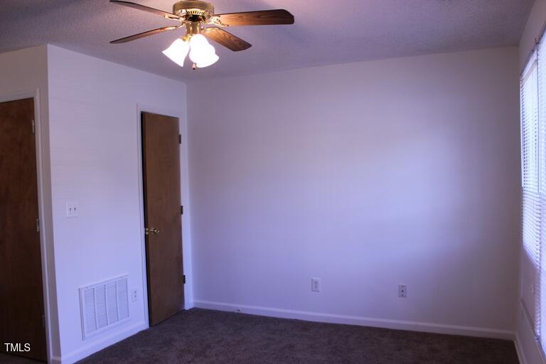 2942 Faversham Place Raleigh, NC 27604 - Photo 3 of 8 en empty room with a fan and a fan