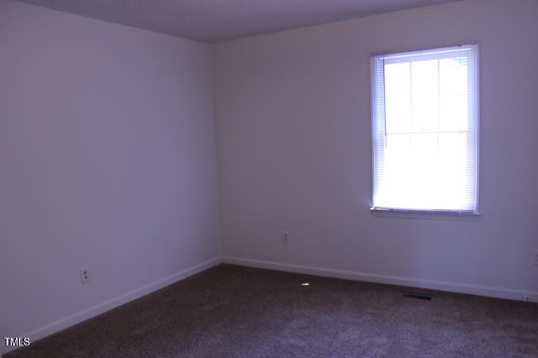 2942 Faversham Place Raleigh, NC 27604 - Photo 5 of 8 an empty room with a window