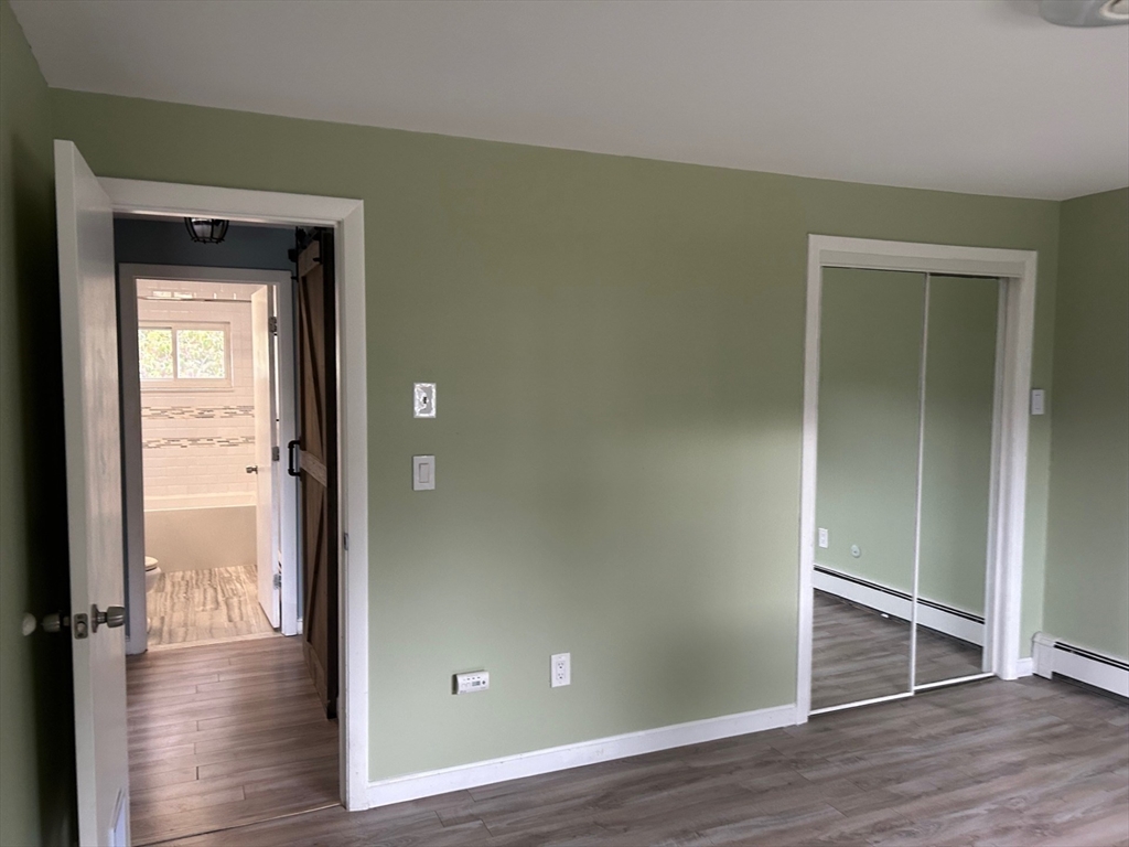 37 Will Drive, Unit 12 Canton, MA 02021 - Photo 11 of 20 a view of empty room with wooden floor