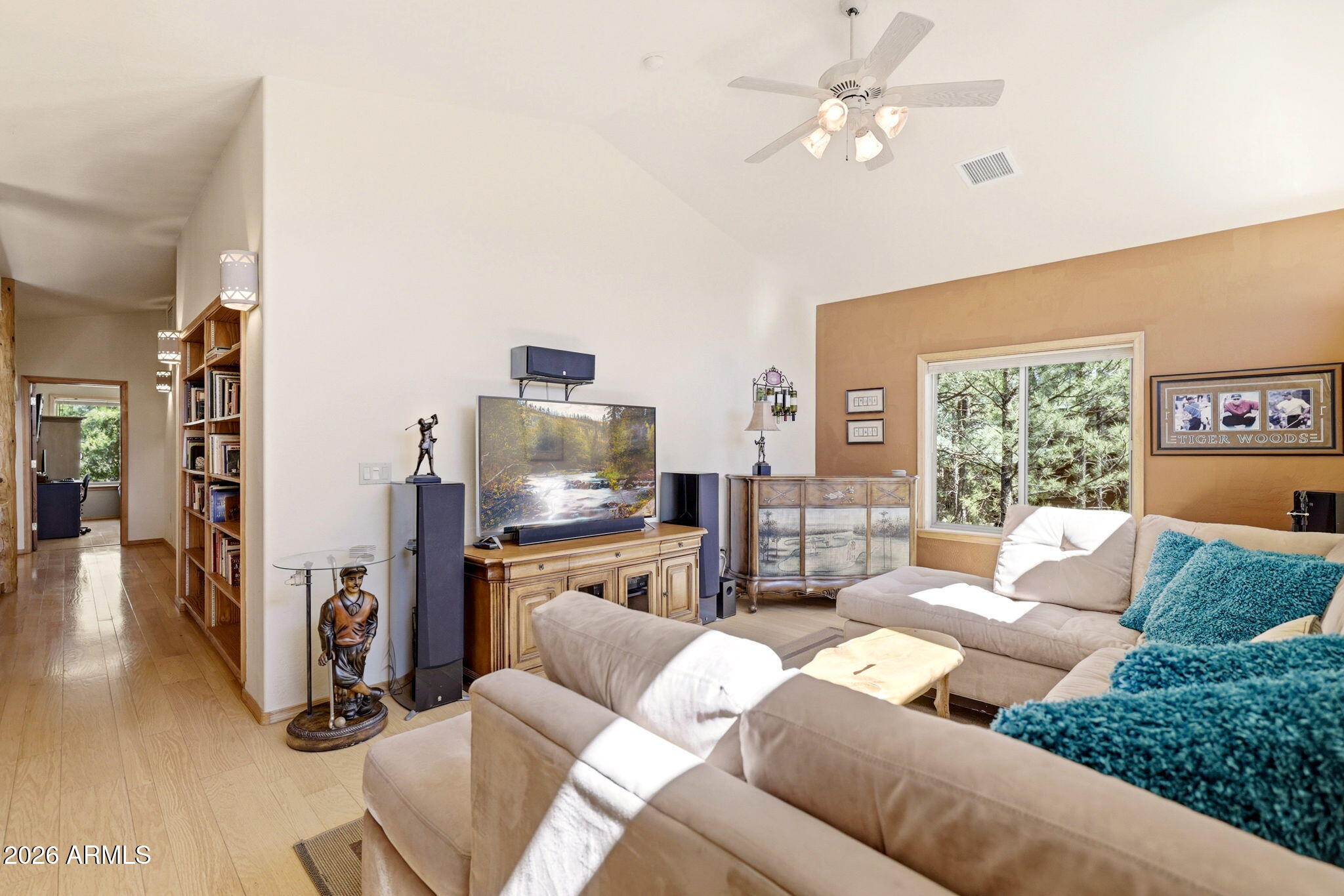 826 Pine Creek Circle Lakeside, AZ 85929 - Photo 21 of 63 a living room with furniture a fireplace and a flat screen tv