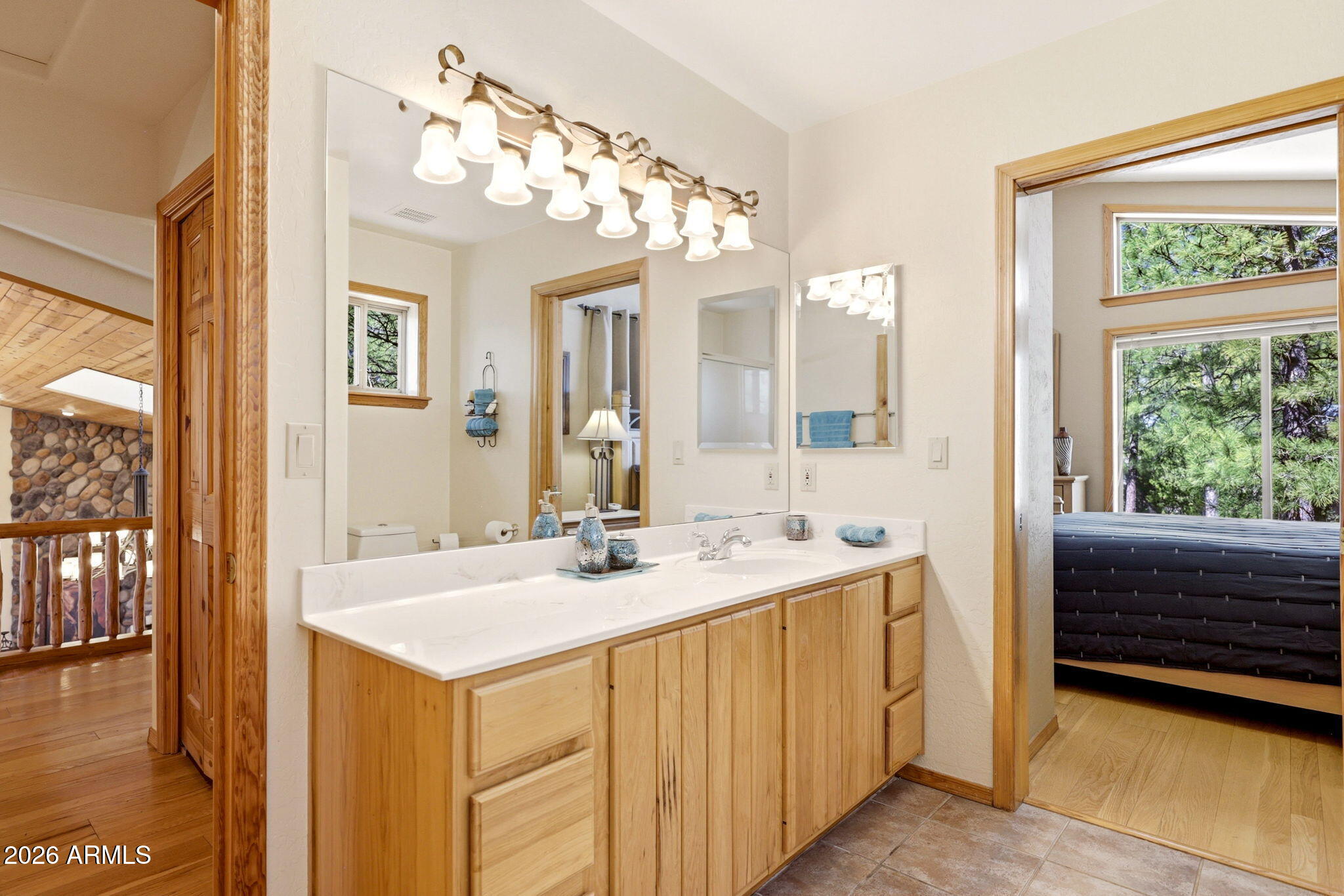 826 Pine Creek Circle Lakeside, AZ 85929 - Photo 24 of 63 a bathroom with a sink a vanity and a mirror