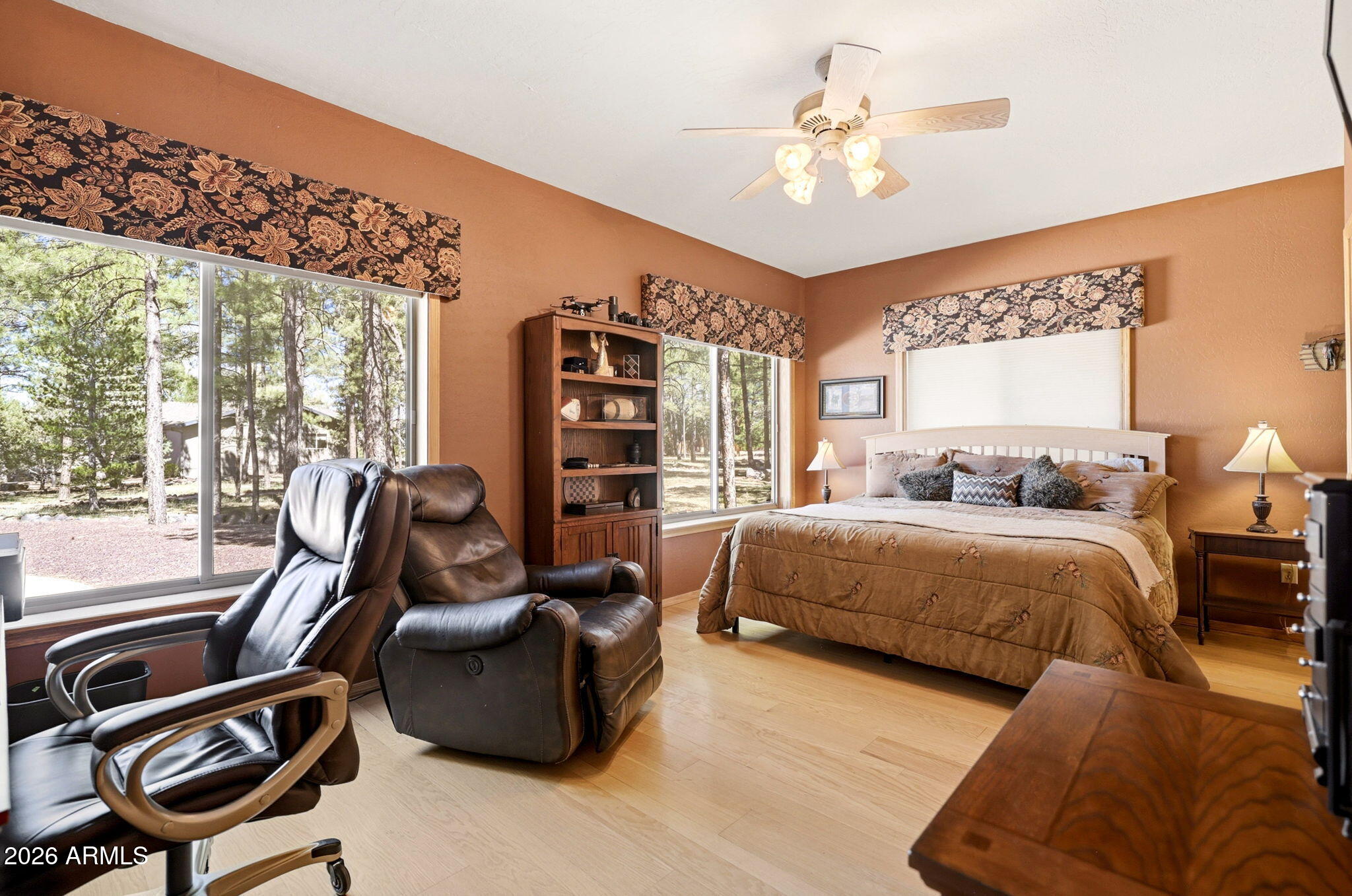 826 Pine Creek Circle Lakeside, AZ 85929 - Photo 26 of 63 a bedroom with a bed a couch and a chandelier