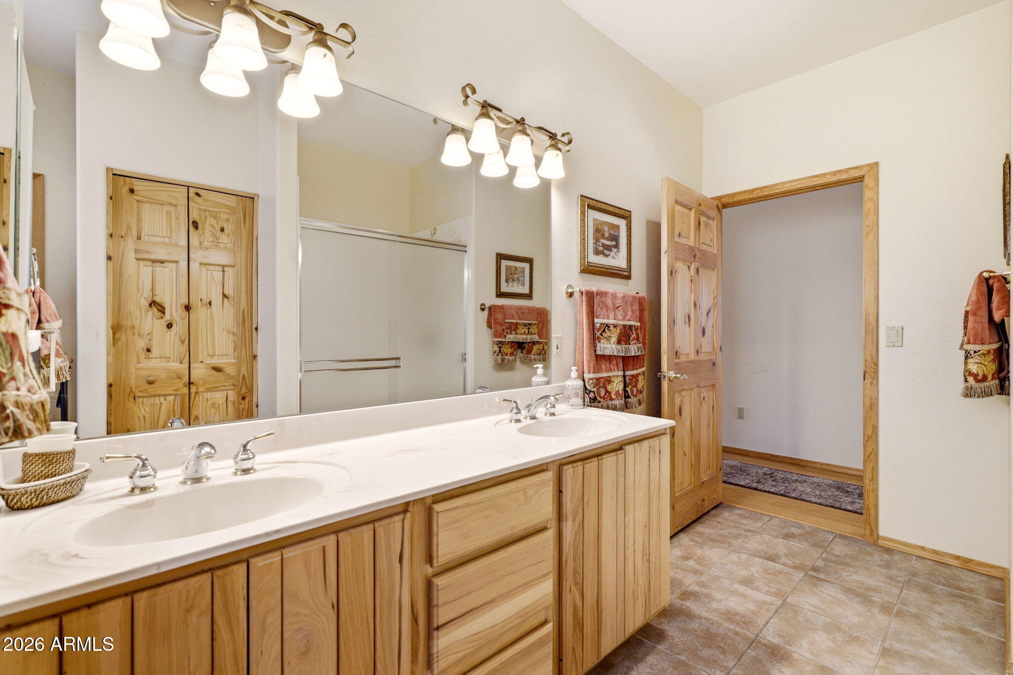 826 Pine Creek Circle Lakeside, AZ 85929 - Photo 28 of 63 a bathroom with a sink a vanity and a mirror