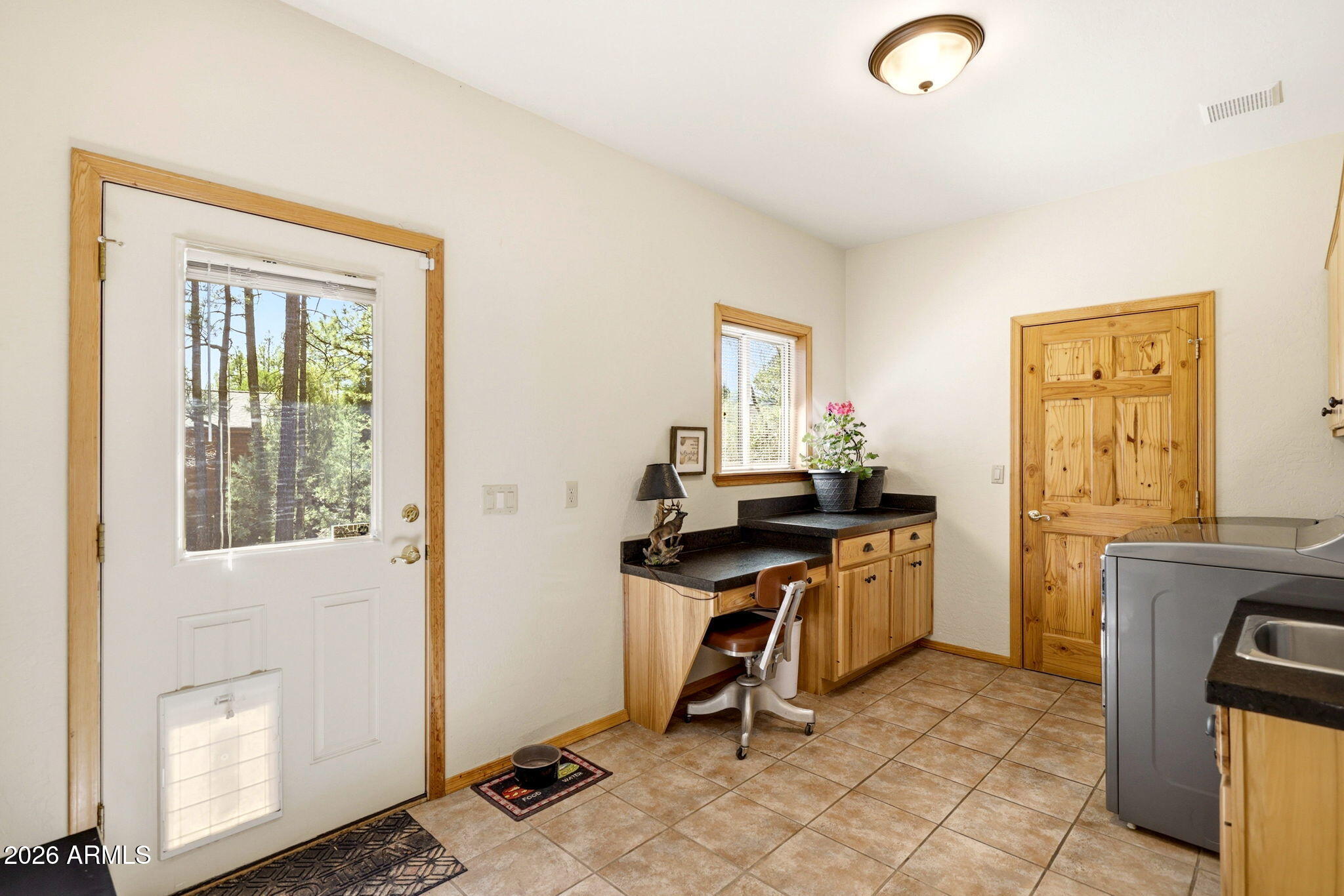 826 Pine Creek Circle Lakeside, AZ 85929 - Photo 33 of 63 a view of a workspace with furniture and a window