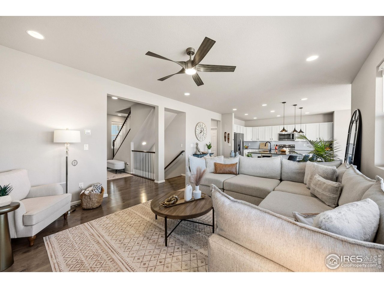 5247 Alberta Falls Street Timnath, CO 80547 - Photo 13 of 43 Living room open to kitchen