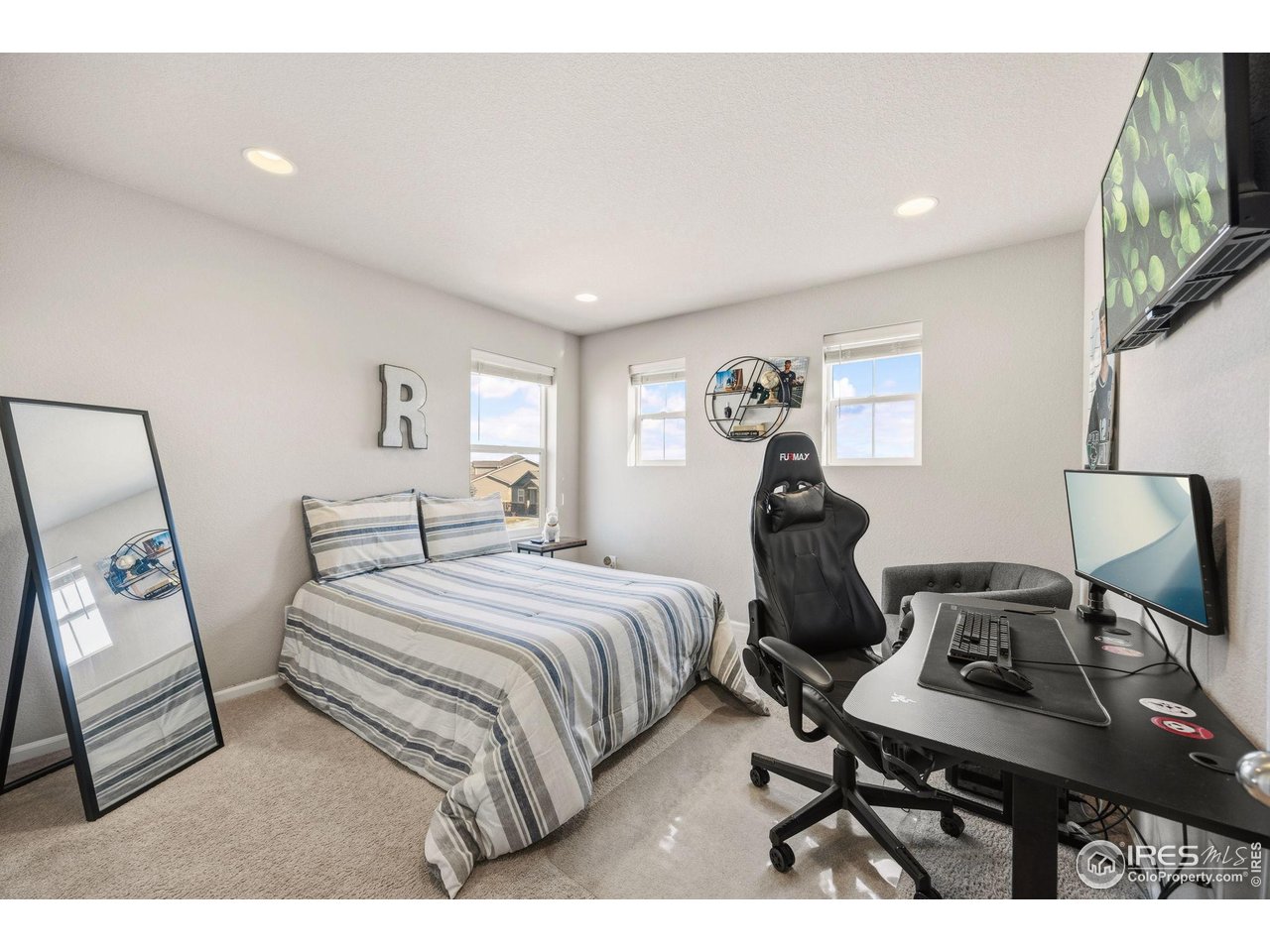 5247 Alberta Falls Street Timnath, CO 80547 - Photo 26 of 43 Bright and versatile third bedroom with recessed lighting, space for a desk and sitting area