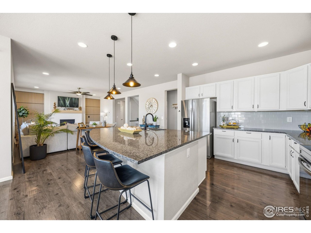 5247 Alberta Falls Street Timnath, CO 80547 - Photo 7 of 43 Kitchen overlooking main living area