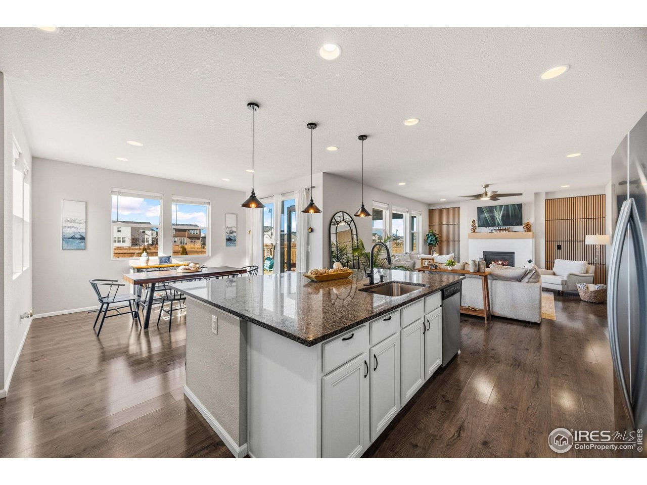 5247 Alberta Falls Street Timnath, CO 80547 - Photo 8 of 43 Open-concept kitchen flowing into dining area