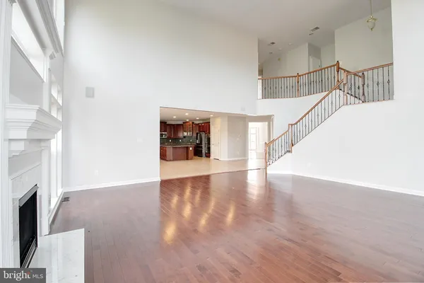 a view of main area with wooden floor and fireplace