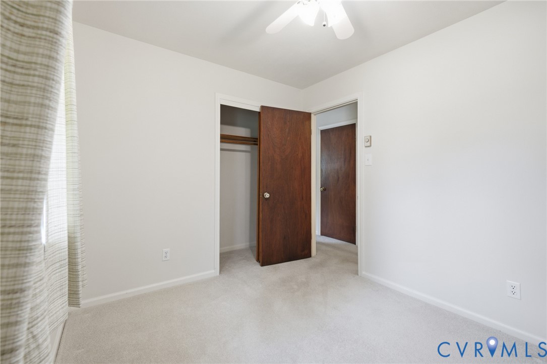 10215 River Road Petersburg, VA 23803 - Photo 18 of 31 Light-toned carpeting, white painted walls, and a
