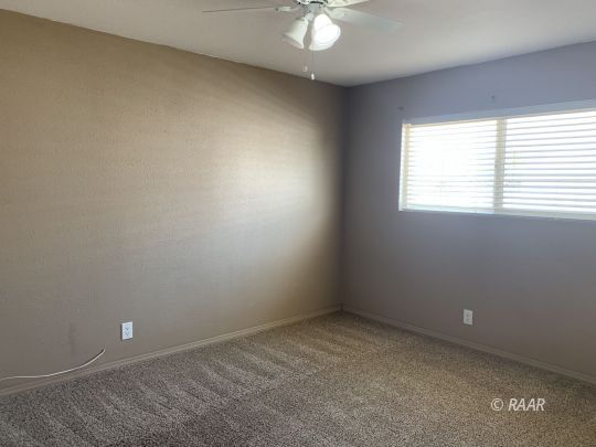 1004 South Farragut Street Ridgecrest, CA 93555 - Photo 10 of 13 an empty room with a window
