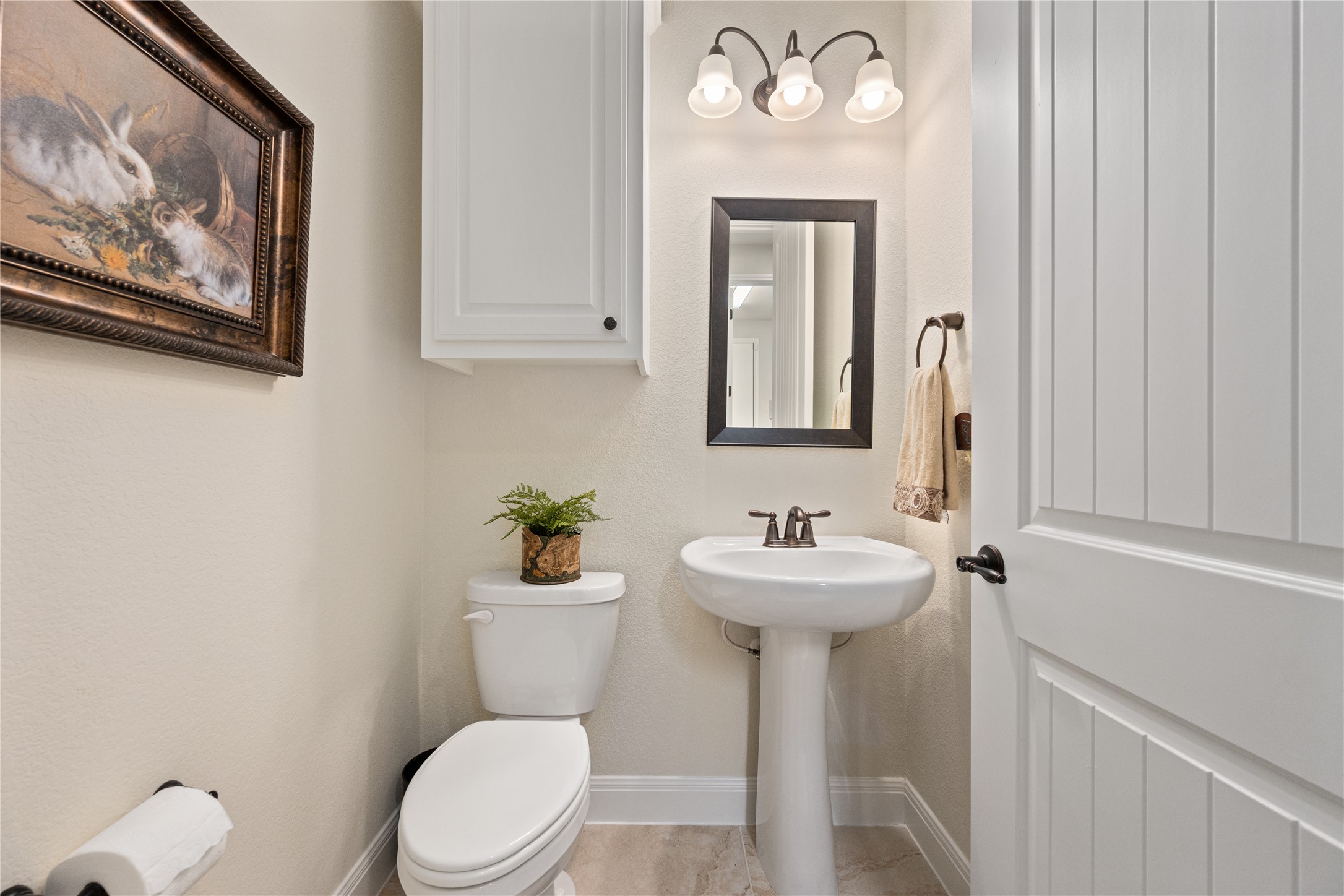 220 Fairway Ridge Road Georgetown, TX 78633 - Photo 25 of 40 Convenient half bath located near the flex room and laundry area.