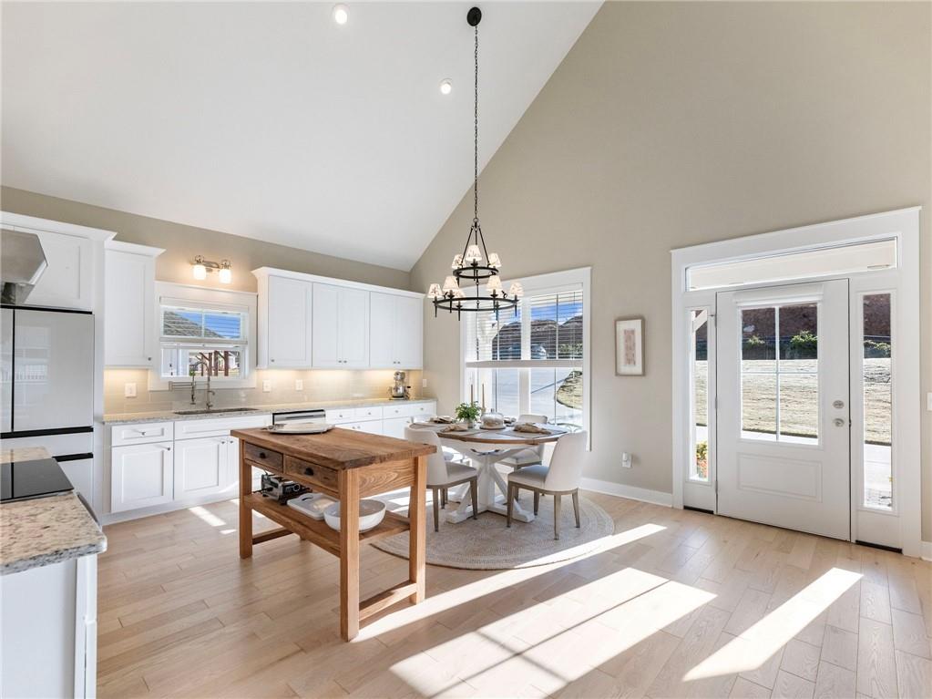 232 Campbell Street Cleveland, GA 30528 - Photo 13 of 37 a view of a dining room with furniture window and wooden floor