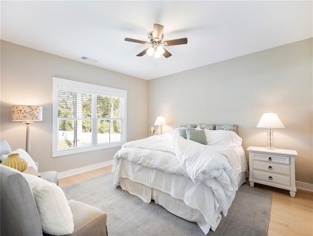 232 Campbell Street Cleveland, GA 30528 - Photo 15 of 37 a spacious bedroom with a bed and a couch
