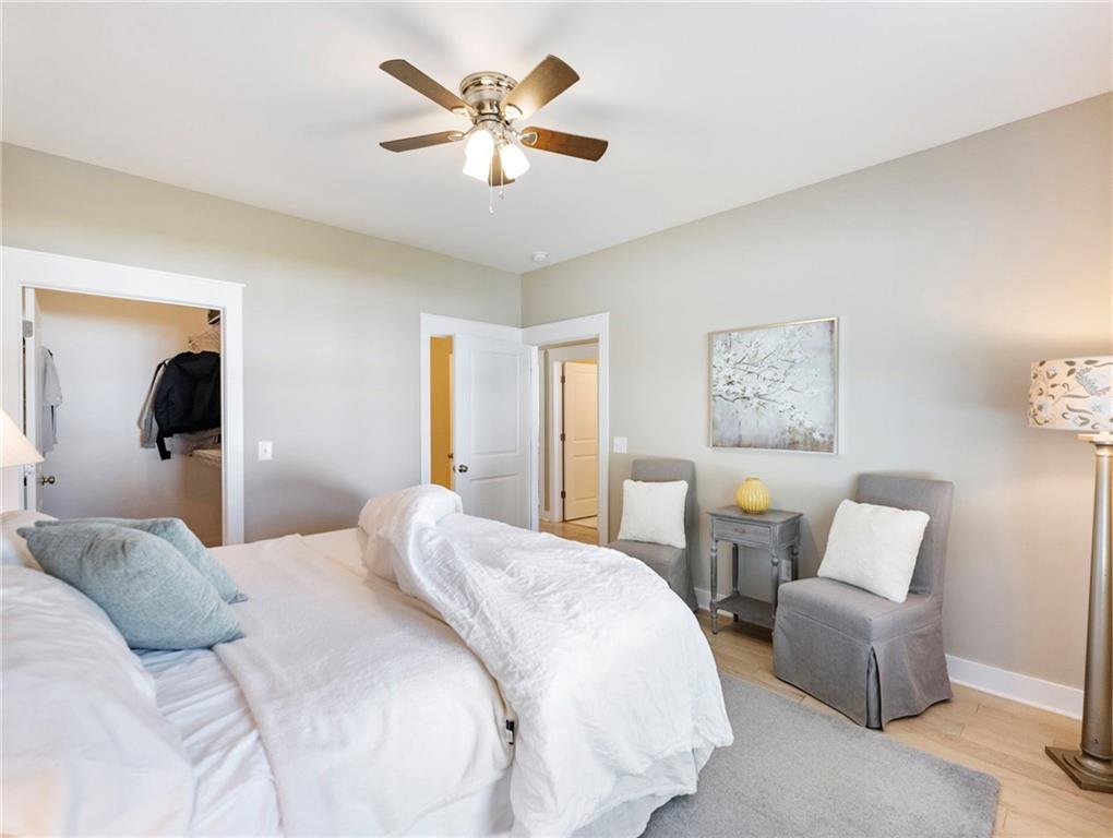 232 Campbell Street Cleveland, GA 30528 - Photo 16 of 37 a bedroom with a bed and a chandelier