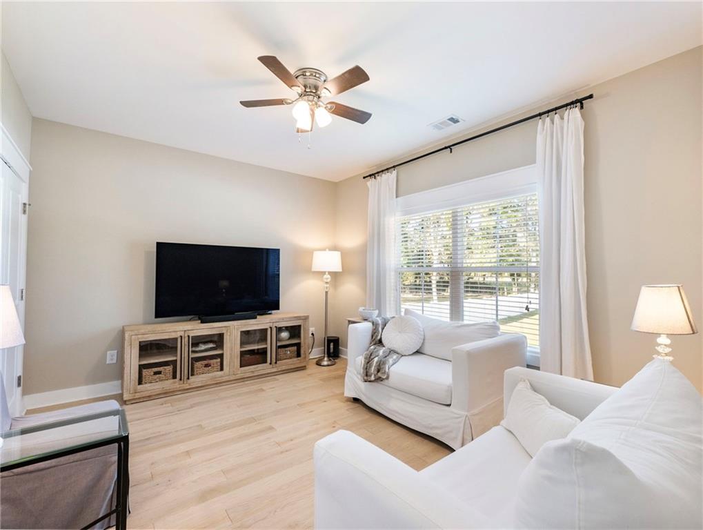 232 Campbell Street Cleveland, GA 30528 - Photo 19 of 37 a living room with furniture and a flat screen tv