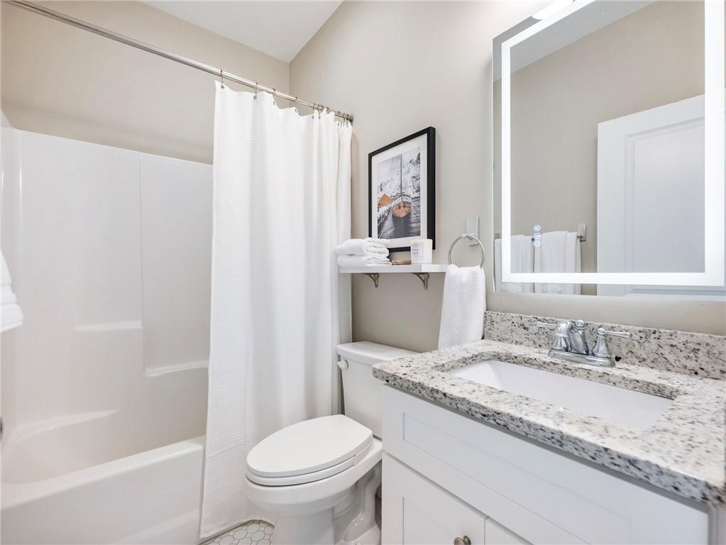 232 Campbell Street Cleveland, GA 30528 - Photo 21 of 37 a bathroom with a granite countertop sink toilet and shower