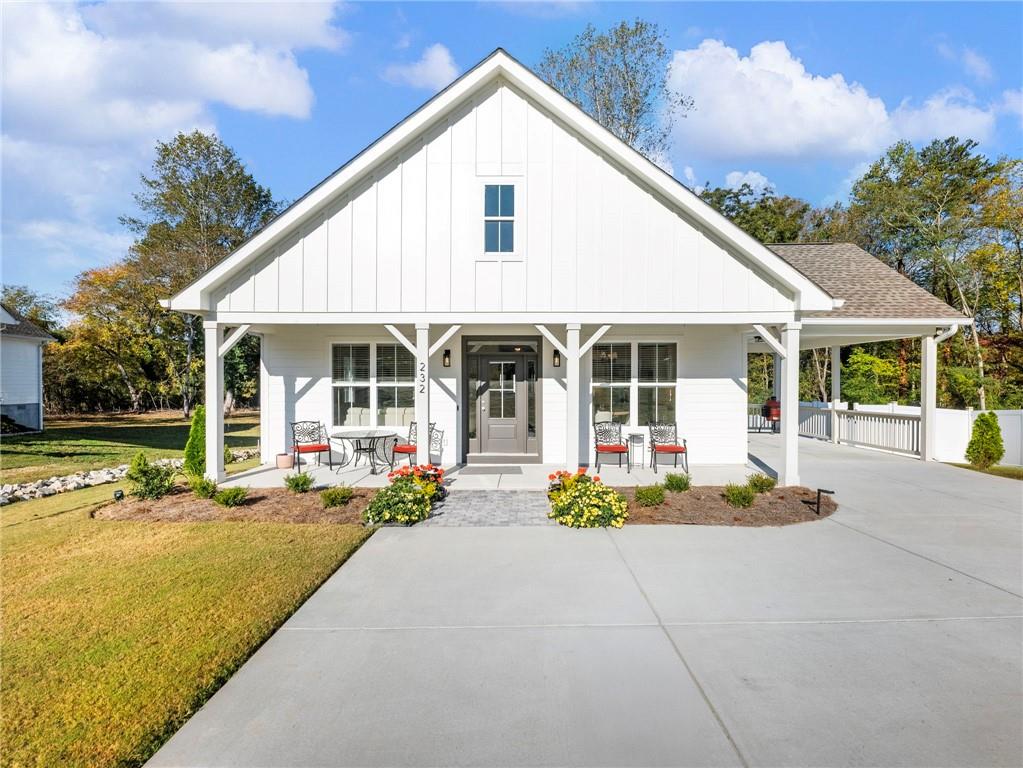 232 Campbell Street Cleveland, GA 30528 - Photo 24 of 37 a front view of a house with swimming pool and porch with furniture