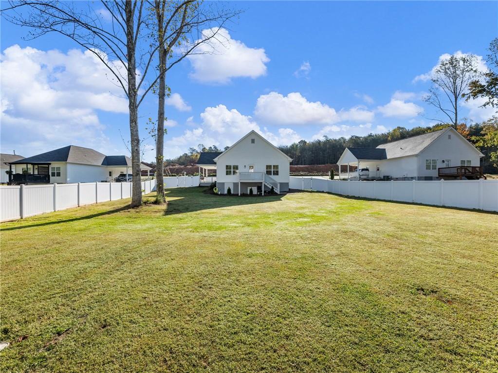 232 Campbell Street Cleveland, GA 30528 - Photo 34 of 37 a swimming pool with outdoor seating and yard