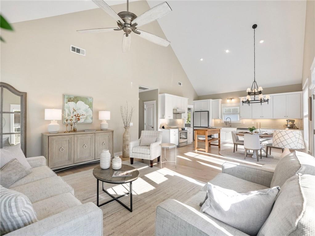 232 Campbell Street Cleveland, GA 30528 - Photo 5 of 37 a living room with furniture kitchen view and a wooden floor