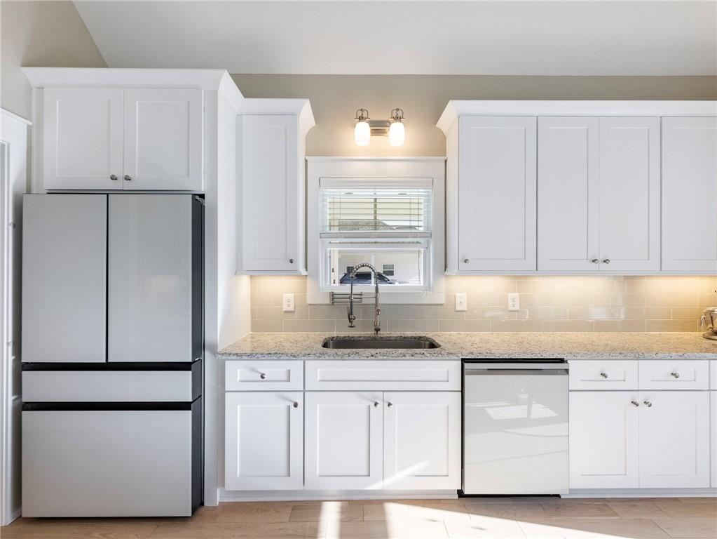232 Campbell Street Cleveland, GA 30528 - Photo 10 of 37 a kitchen with white cabinets and refrigerator