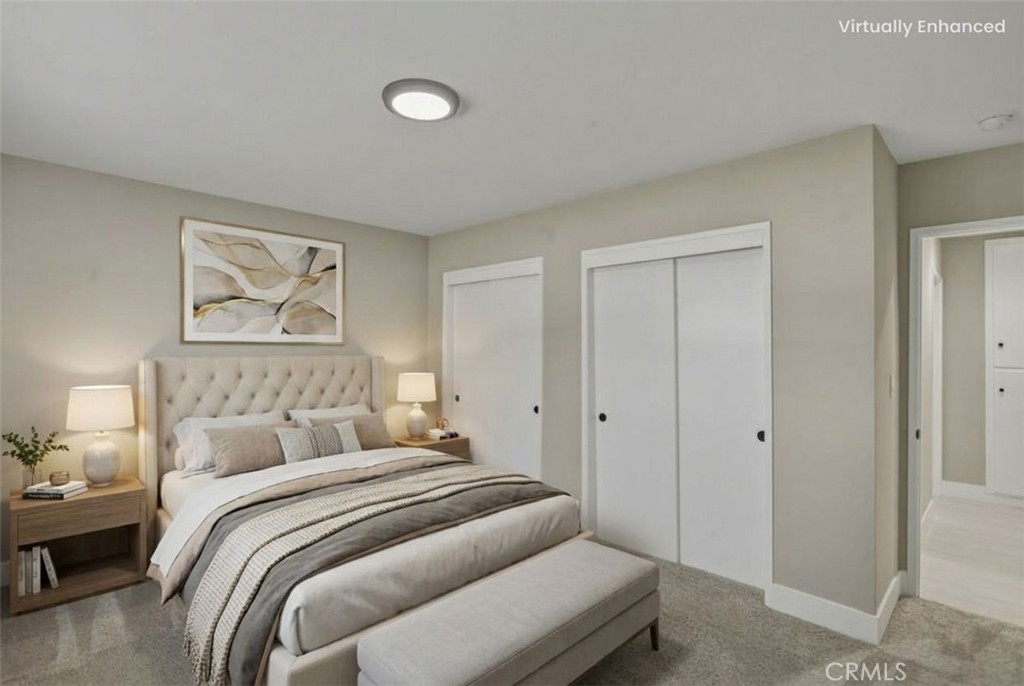 5874 Olive Avenue Rialto, CA 92377 - Photo 13 of 50 a bedroom with a bed and a painting on the wall