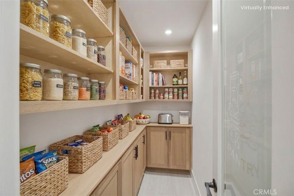 5874 Olive Avenue Rialto, CA 92377 - Photo 15 of 50 a storage room with stainless steel appliances lots of clutter and washer