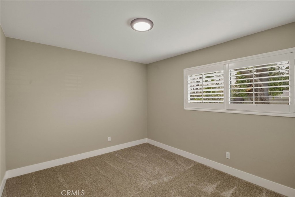 5874 Olive Avenue Rialto, CA 92377 - Photo 16 of 50 an empty room with a window