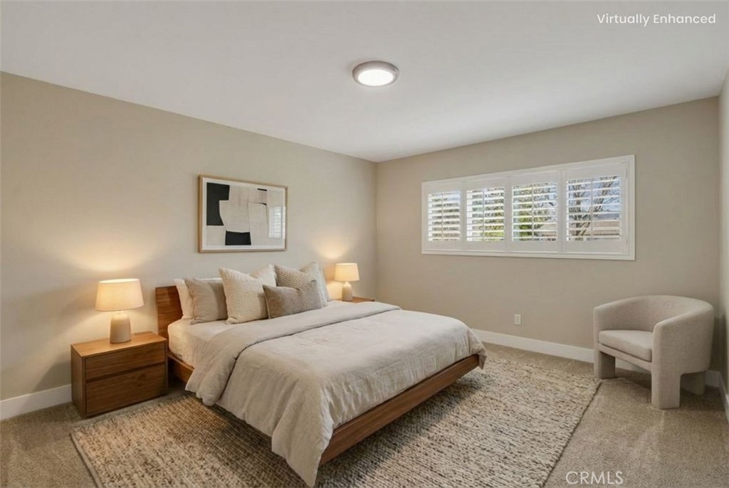 5874 Olive Avenue Rialto, CA 92377 - Photo 17 of 50 a bedroom with a bed and a couch