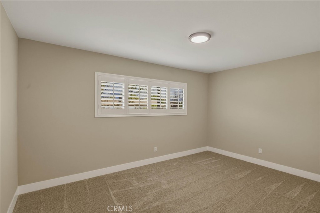 5874 Olive Avenue Rialto, CA 92377 - Photo 30 of 50 an empty room with a window