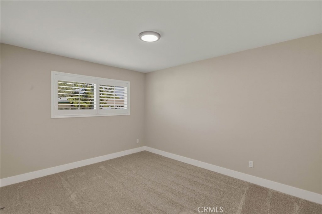 5874 Olive Avenue Rialto, CA 92377 - Photo 31 of 50 an empty room with a window