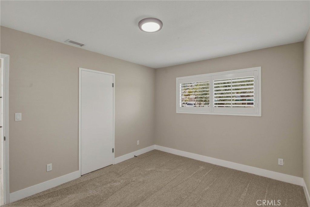 5874 Olive Avenue Rialto, CA 92377 - Photo 32 of 50 an empty room with a window
