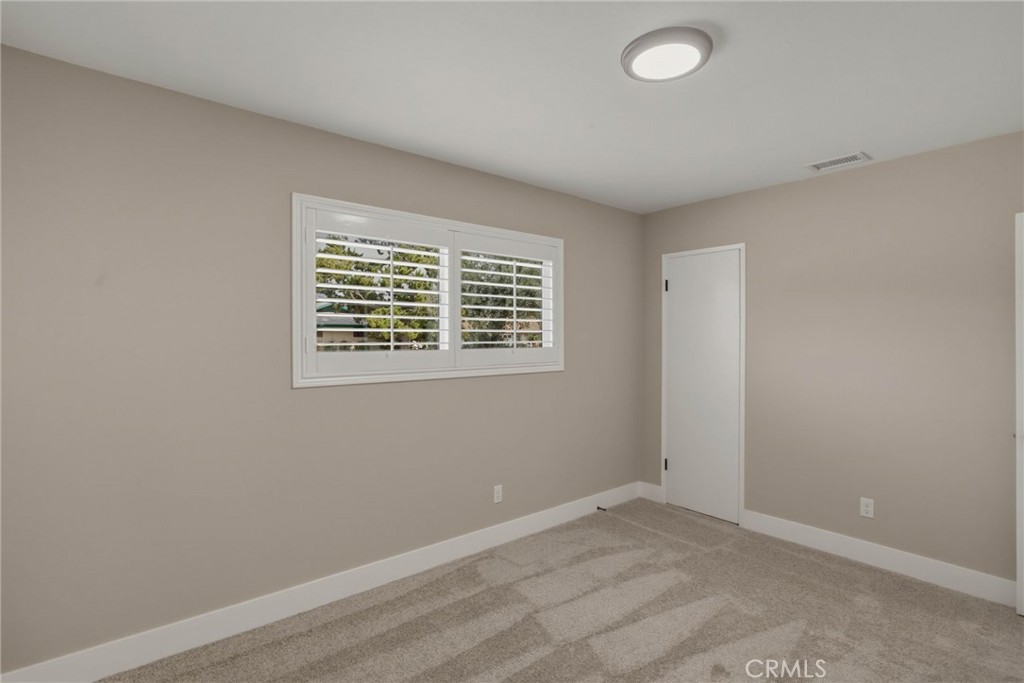 5874 Olive Avenue Rialto, CA 92377 - Photo 33 of 50 an empty room with a window