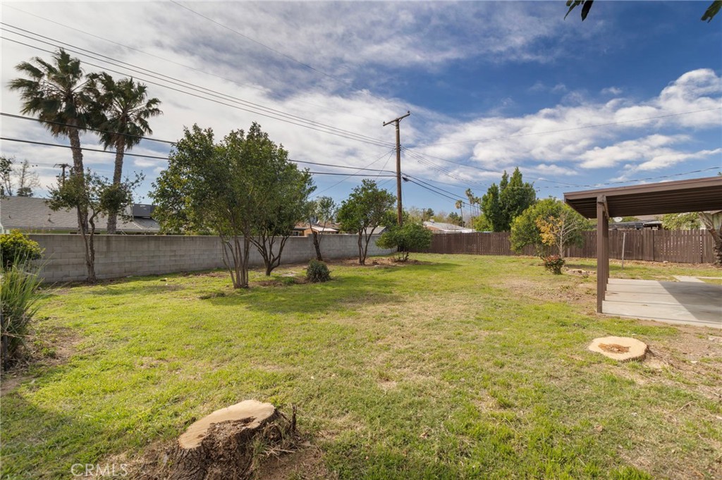 5874 Olive Avenue Rialto, CA 92377 - Photo 41 of 50 a swimming pool with some trees in the background