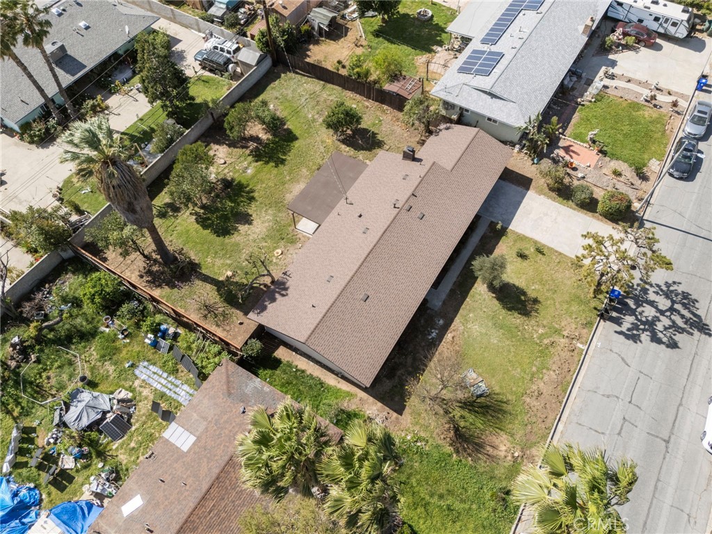 5874 Olive Avenue Rialto, CA 92377 - Photo 44 of 50 an aerial view of residential houses with outdoor space