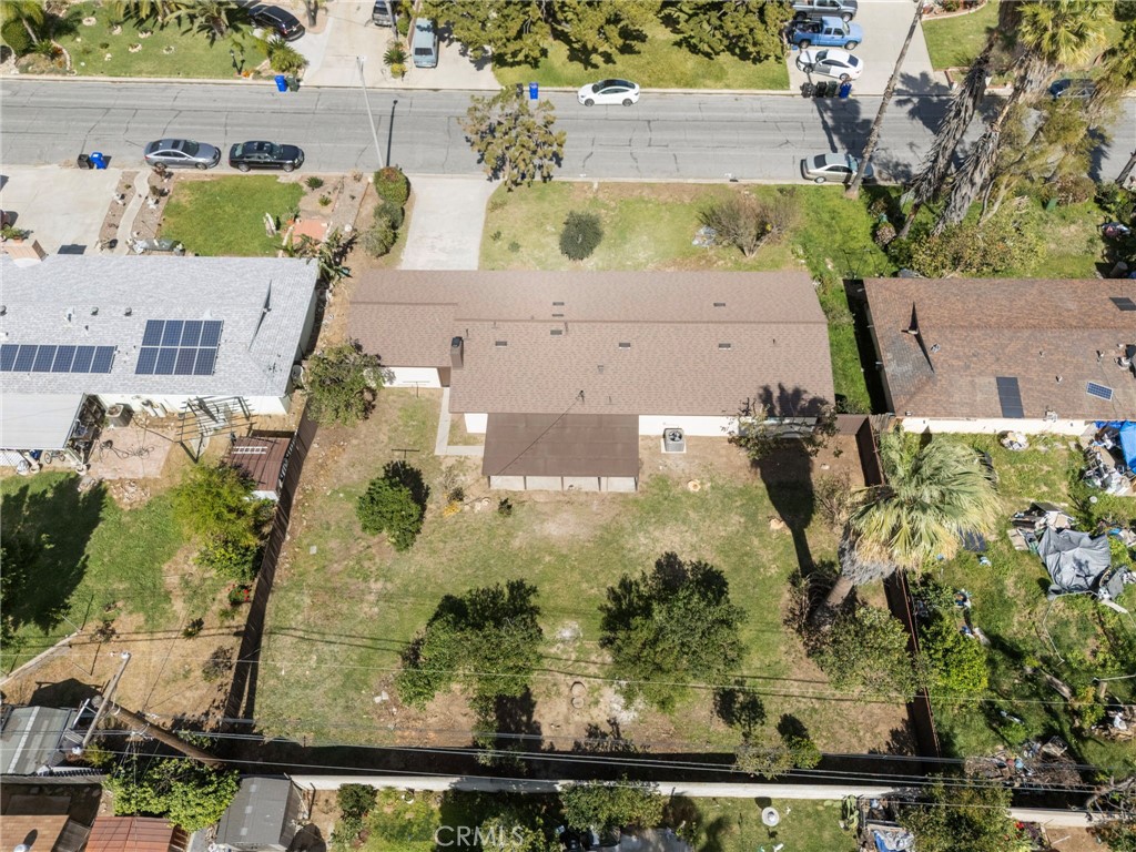 5874 Olive Avenue Rialto, CA 92377 - Photo 45 of 50 an aerial view of residential houses with outdoor space