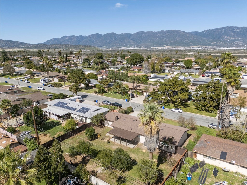 5874 Olive Avenue Rialto, CA 92377 - Photo 48 of 50 an aerial view of residential house and sandy dunes