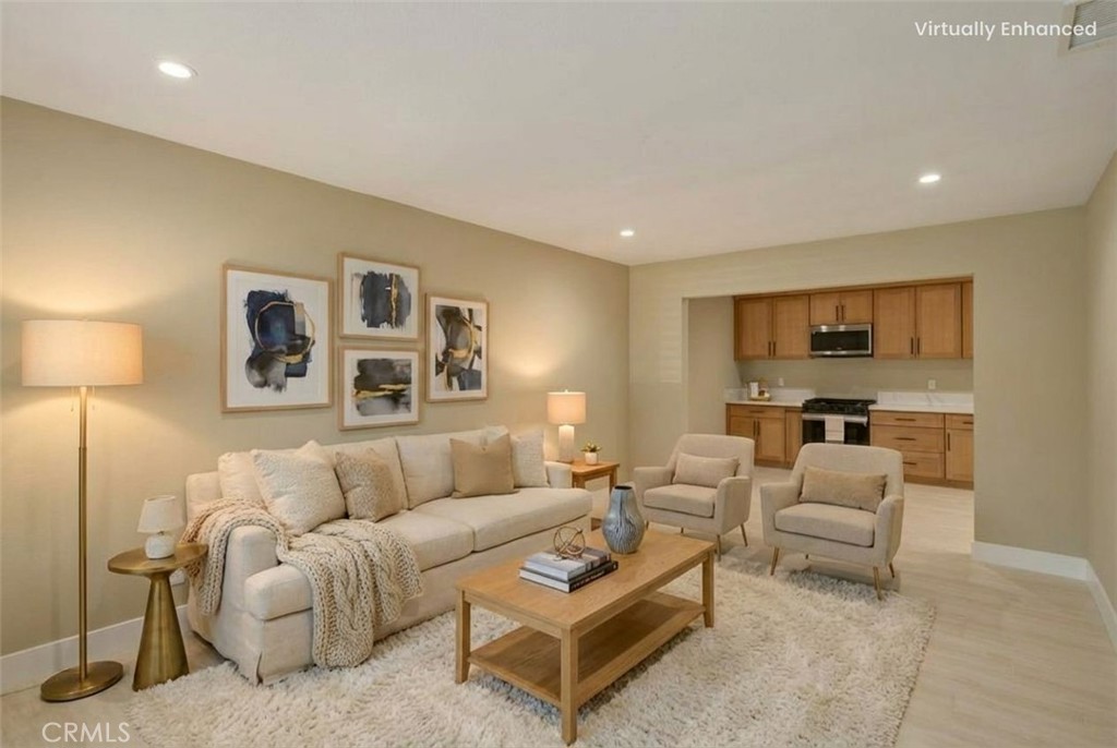 5874 Olive Avenue Rialto, CA 92377 - Photo 8 of 50 a living room with furniture a lamp and a flat screen tv