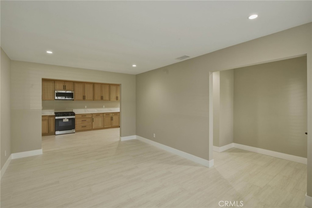 5874 Olive Avenue Rialto, CA 92377 - Photo 9 of 50 a view of a kitchen with a sink and dishwasher cabinets