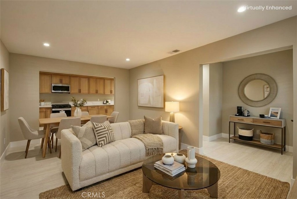 5874 Olive Avenue Rialto, CA 92377 - Photo 10 of 50 a living room with furniture and a mirror