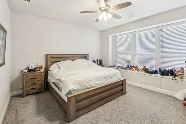 a bed room with a bed and a chandelier