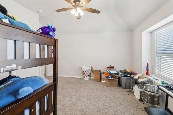 a bedroom with furniture and a chandelier