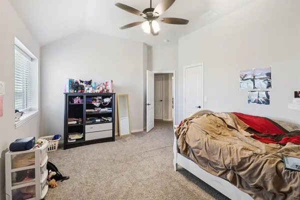 a bedroom with a bed and a closet