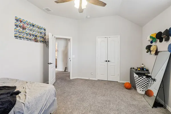 a bedroom with bed and window