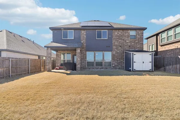 a view of a house with a yard and garage