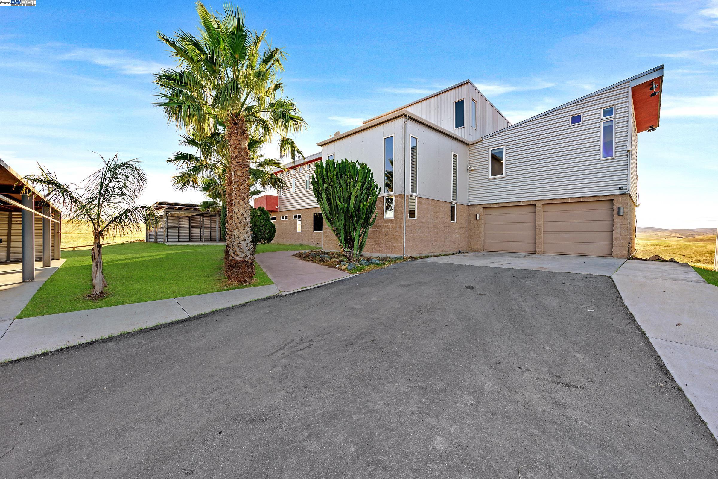 17011 North Midway Road Tracy, CA 95377 - Photo 12 of 52 front view of a house with a street