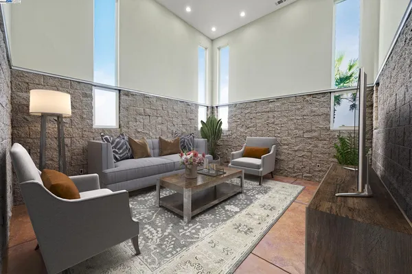 a living room with furniture a flat screen tv a lamp and a fireplace