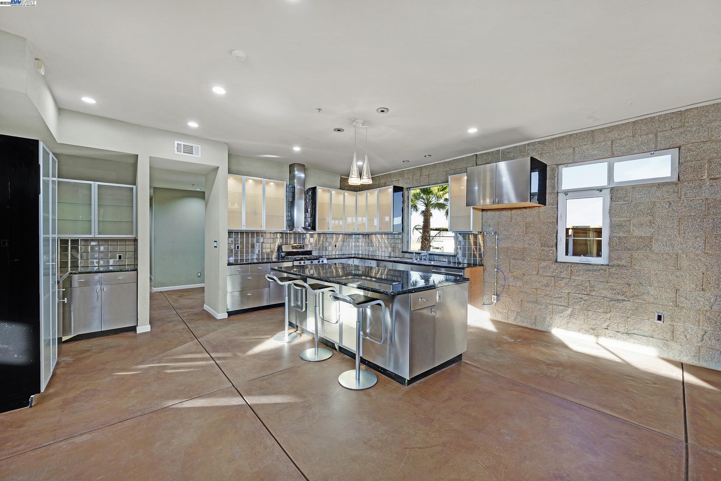 17011 North Midway Road Tracy, CA 95377 - Photo 19 of 52 a kitchen with stainless steel appliances granite countertop a stove and a refrigerator