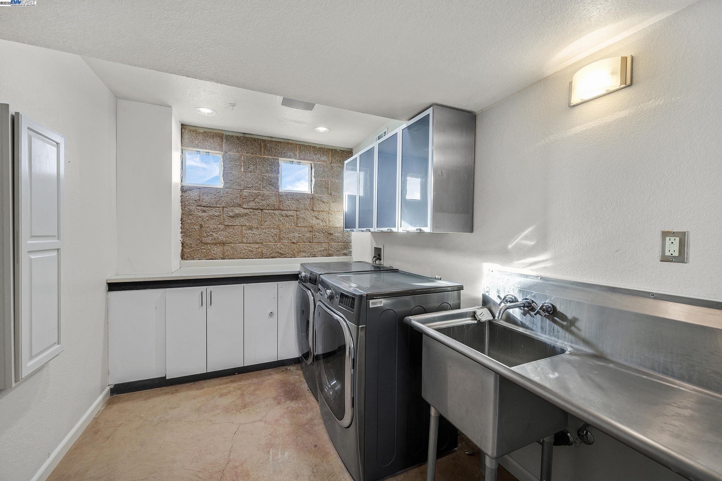 17011 North Midway Road Tracy, CA 95377 - Photo 24 of 52 a kitchen with a sink stove and cabinets