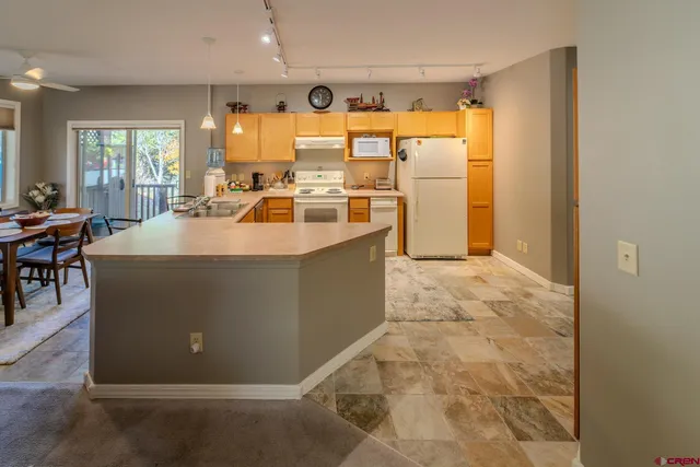 a room with sink cabinets and outdoor view